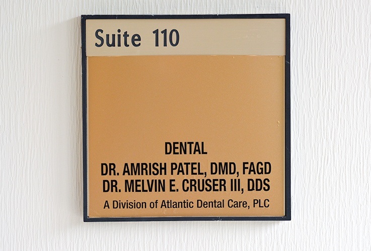 Dr. Amish and Dr. Patel sign